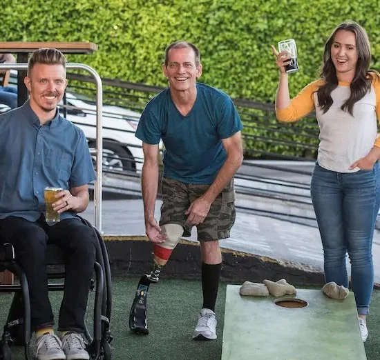 Group of NDIS participants enjoying an inclusive community activity outdoors
